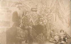 Department Store Santa with Child on Pony Postcard