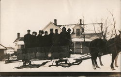 Winter Scene - Horse-drawn sleigh, group of people in front of house Postcard