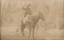 Cowboy shooting gun sitting a horse Postcard