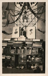 Bookcase with books, portraits, January 1914 calendar on wall Postcard