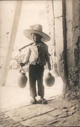 Mexican boy with water jugs Postcard