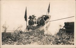 Three people in a boat with flags Postcard