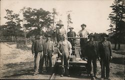 Men posing with Railroad hand car - Hamond Lumber Co. Postcard