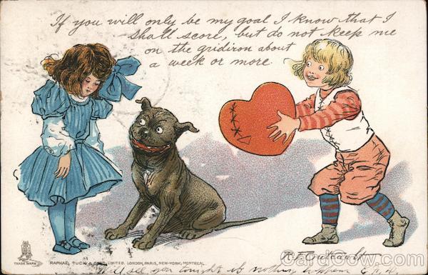 Young boy and girl with dog and the boy is holding a heart