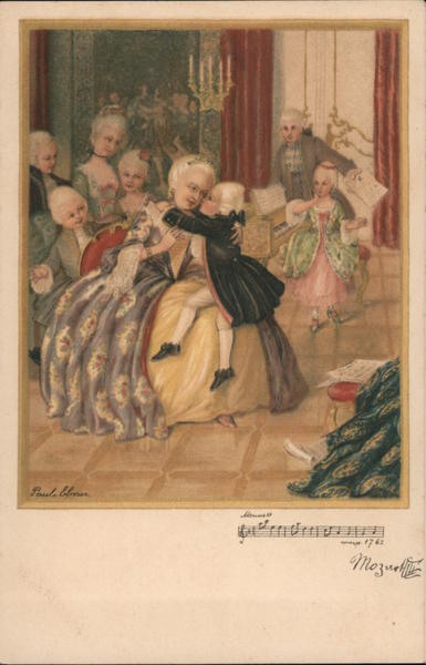 Group of people gathered near piano; boy sits on woman's lap and kisses her cheek