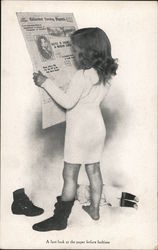 A last look at the paper before bedtime Postcard