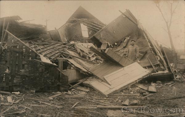 Tornado? Man stands among the ruins of a demolished building
