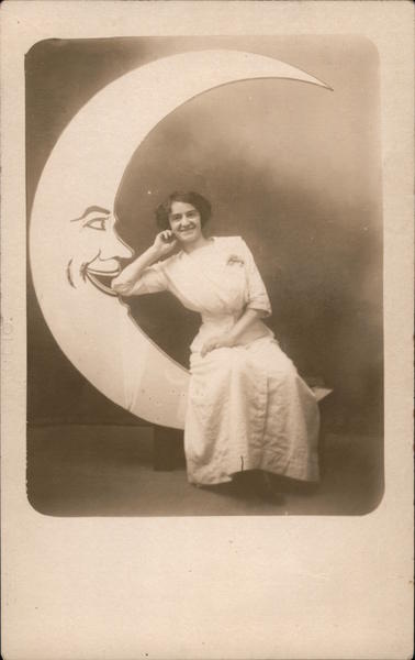 Woman sitting on Paper Moon Moons
