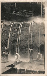 People bathing, sitting beneath falling water Japan? Postcard