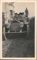 Old man and child in an old car Postcard