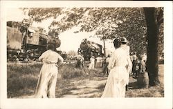 People gathered around train engines Postcard