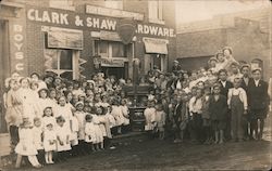 Majestic Ranges - Large group posing outside Clark & Shaw Hardware Postcard