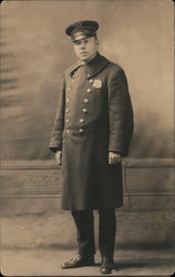 Man in uniform with long coat Postcard