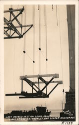 Last roabed section being raised to Bay Bridge, between San Francisco and center anchorage Postcard