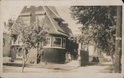 PEOPLE IN FRONT OF A HOUSE Postcard