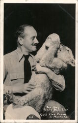 Mr. Gay Feeding Baby Lion at Gay's Lion Farm Postcard