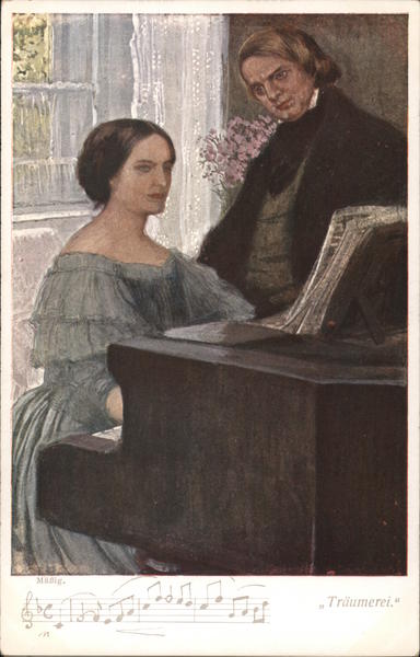 A Woman Sitting at a Piano with a Man Standing Next to Her