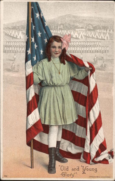 Young girl holding a flag draped behind her. Old and Young Glory Military camp in the background.