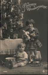 Children and a Christmas tree. Christmas Greetings in German Postcard