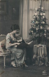 A Woman and her Child Read a Book at Christmastime Postcard