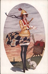 French woman stands next to windmill and dog. Series 169 Postcard