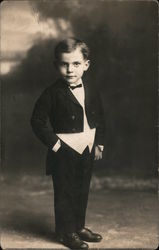 Circus? Small boy dressed in coat tails poses with hand in pocket Postcard