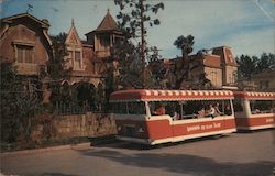 The chill of the Munsters is felt on Mockingbird Lane as the tram passes their spooky, cobwebbed home Postcard