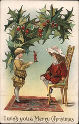 I Wish you a Merry Christmas - A Boy and Girl Under Holly Postcard