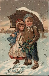 Christmas Greetings - Two Children Under an Umbrella In the Snow Postcard