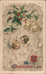 A Merry Christmas to You - Holly and Bells hang above the Busts of Angels Postcard