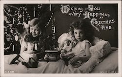 Two Girls With Toys in Bed Postcard