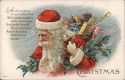 Christmas - Santa Carrying Toys Through Snow Postcard
