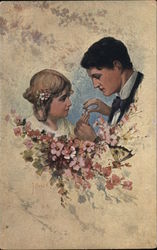 Groom giving bride a ring Postcard