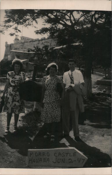 People Standing in Front of a Sign Saying Morro Castle Havana Cuba