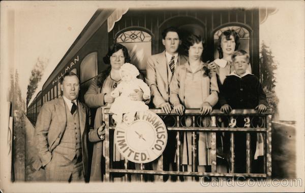 A Family Posing in Front of a Picture of the Back of a Train San Francisco California