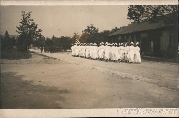 A Group of Nurses Following a Group of Soldiers Military