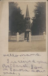 Boy in front of Church, Fence Postcard
