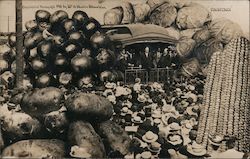 A Group of People Surrounded by Potatoes & Vegetables Postcard