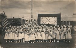 A Group of Nurses Standing in Front of a Flag Postcard