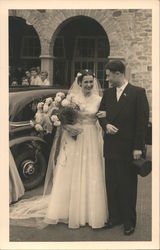 A Bride and Groom Standing Outside a Church Postcard
