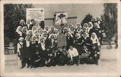 Group of nurses in uniform - Red Cross workers, Cyrillic lettering on sign World War II Postcard Postcard Postcard