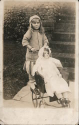A Girl Pushing a Doll in a Play Stroller Postcard