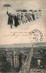 The whole family sends greetings. Family flying by umbrellas over city. Postcard
