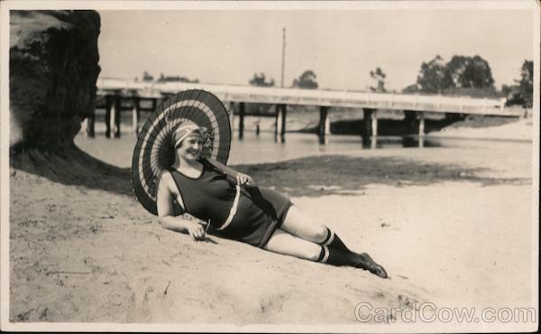 Smiling Woman Posing in Swimsuit with Umbrella Women