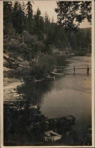 Boat landing on lake, foot bridge, row boats Vacation California