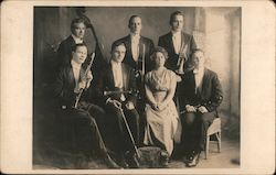 Group Photo of Seven Member Band wearing Formal Clothing and Holding Musical Instruments Postcard