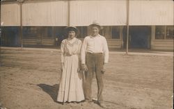 Couple standing in road Postcard