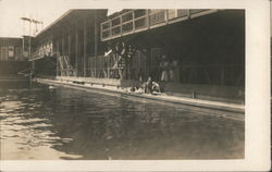 Two Women Sitting Next to a Swimming Pool Postcard