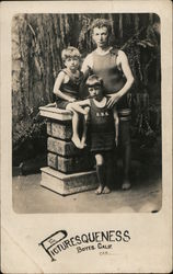 Picturesqueness. Man and two boys in swimsuits studio portrait Postcard