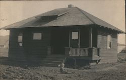 A child sits and Plays in the front yard of a home in Santa Rosa, California Postcard